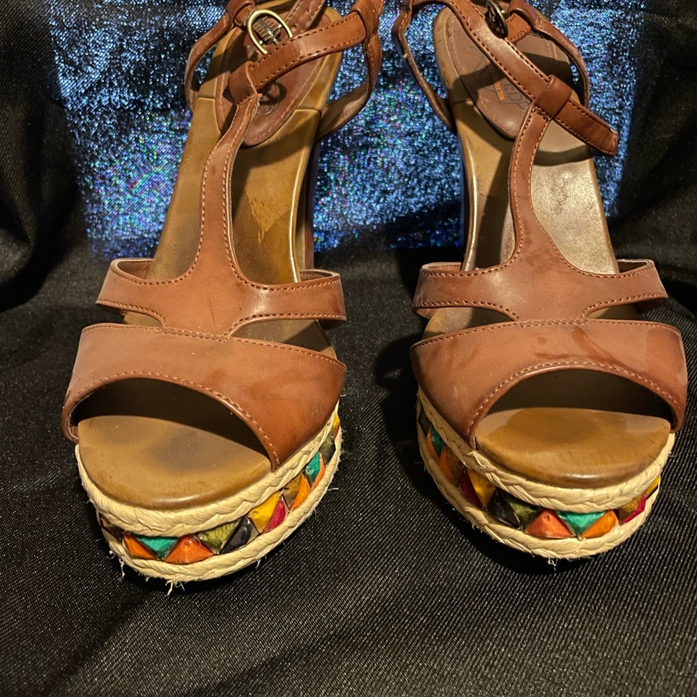 “Unlisted by Kenneth Cole Productions.” Platform high heeled shoes, size 8.